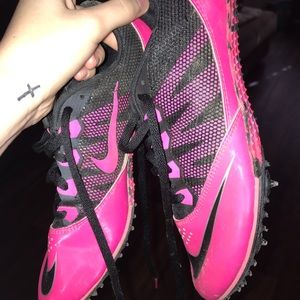 Pink & black Nike track spikes